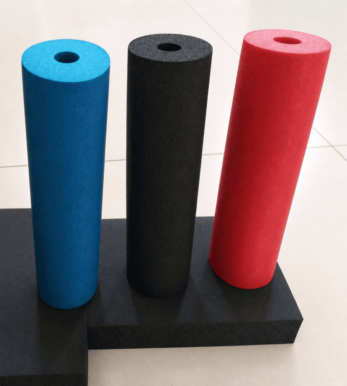 Blue black and red PVC-NBR foam cylinders